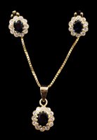 Lot 678 - Sapphire and diamond pendant and matching...