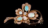 Lot 681 - Edwardian opal and diamond brooch, the...