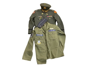 Lot 752 - Group of American USAF uniforms to include flight overalls named to Deselms, flying jacket with attached hood, USAF shirt, Flight Ace cap, and a 1960's uniform and cap (2 boxes).