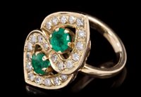 Lot 683 - Emerald and diamond cocktail ring in the form...