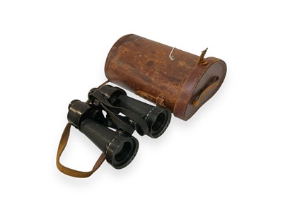 Lot 768 - Pair of Second World War British Military Barr & Stroud binoculars with lens shades, marked with broad arrow, in brown leather case.