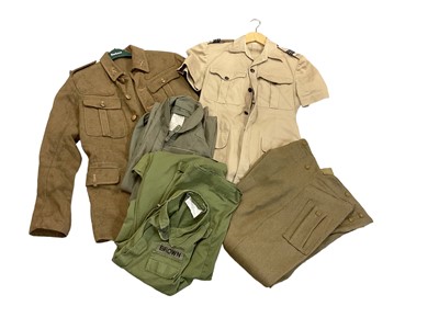 Lot 753 - Group of British military uniforms to include a coverall named to Brown, pantaloons in size 10, a Second World War era service dress jacket and RAF Tropical shirt and shorts (1 box).