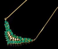 Lot 687 - Emerald and diamond necklace with a V-shaped...