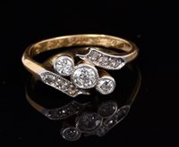 Lot 690 - 1920s diamond three stone engagement ring with...