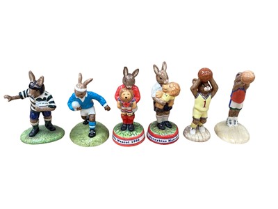 Lot 1288 - Six Royal Doulton Bunnykins figures to include rugby players, basketball players and mascots