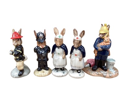 Lot 1294 - Thirteen Royal Doulton Bunnykins figures including American Firefighter, Policeman, Nurse, Homeguard, Air Controller