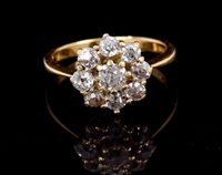 Lot 693 - Diamond cluster ring, the flower-head cluster...