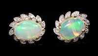 Lot 696 - Pair opal and diamond earrings, each with an...