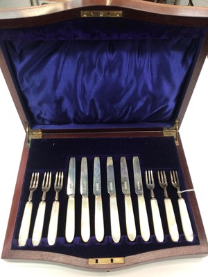 Lot 201 - Set of six 1920s silver fruit knives and forks with mother of pearl handles, in fitted wooden case (Sheffield 1922)