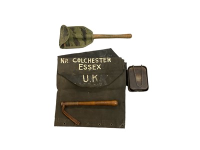 Lot 759 - Two Second World War British military mess tins, marked with broad arrow mark and dated 1940, together with two Second World War kit bags, a truncheon and an American trenching tool.