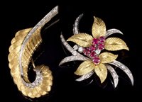 Lot 703 - Two-colour gold (18ct) ruby and diamond floral...