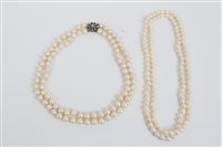 Lot 704 - Cultured pearl double-strand necklace, with...