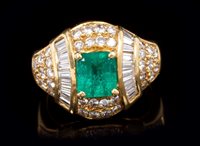 Lot 711 - Emerald and diamond cocktail ring with a...