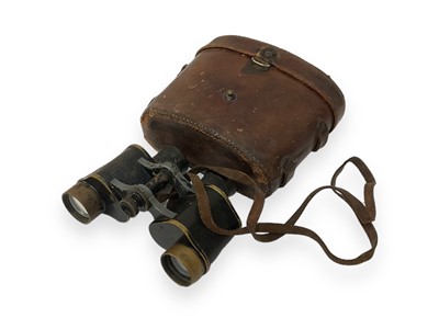 Lot 793 - Pair of First World War British military binoculars, dated 1915, marked with broad arrow mark and numbered no. 24533, by Bausch & Lomb, in brown leather case.