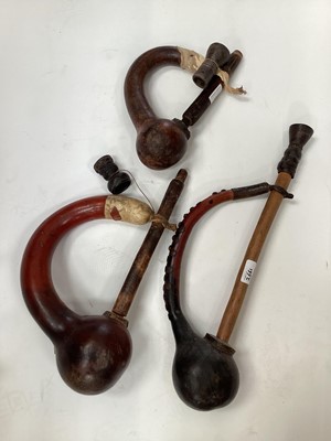 Lot 2661 - Group of three East African gourd smoking/ water pipes, possibly from Tanzania