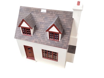 Lot 1976 - Two small brick effect dolls houses, conservatory and one other wooden dolls house all with contents