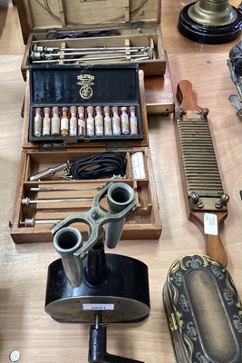 Lot 2691 - Group of medical and scientific instruments, including an antique centrifuge with crank handle, Victorian enema, cased set of homeopathic pills, two pill makers, and two cystoscopes