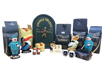 Lot 2694 - Guinness collectables including money boxes and a Johnnie Walker cabinet