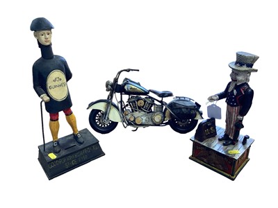 Lot 2695 - Reproduction Uncle Sam and Guinness money boxes and a model of a Harley Davidson (3)