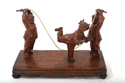 Lot 763 - Chinese Cultural Revolution carved wood group of skipping children