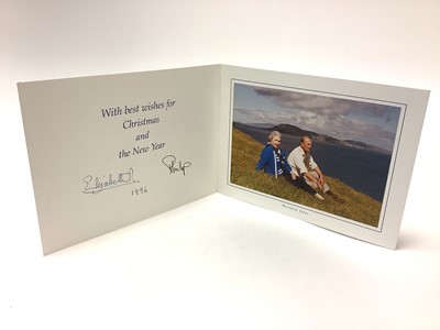 Lot 19 - H.M. Queen Elizabeth II and H.R.H. The Duke of Edinburgh, signed 1996 Christmas card with twin gilt Royal cyphers to cover, colour photograph to the interior of The Queen and Prince Philip relaxin...