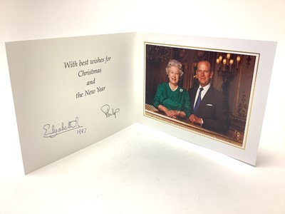 Lot 20 - H.M. Queen Elizabeth II and H.R.H. The Duke of Edinburgh, signed 1997 Christmas card with twin gilt Royal cyphers to cover, colour photograph to the interior of The Queen and Prince Philip smiling...