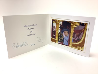 Lot 25 - H.M. Queen Elizabeth II and H.R.H. The Duke of Edinburgh, signed 2002 Christmas card with twin gilt Royal cyphers to cover, colour photograph to the interior of The Queen and Prince Philip riding...