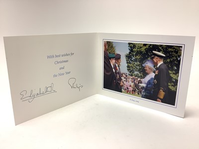 Lot 27 - H.M. Queen Elizabeth II and H.R.H. The Duke of Edinburgh, signed 2004 Christmas card with twin gilt Royal cyphers to cover, colour photograph to the interior of The Queen and Prince Philip meeting...