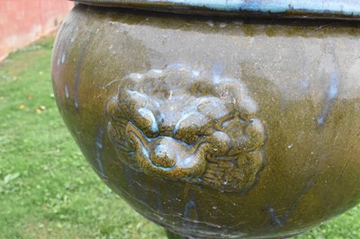 Lot 1185 - Large turquoise glazed ceramic planter with mask handles