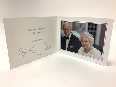 Lot 34 - H.M. Queen Elizabeth II and H.R.H. The Duke of Edinburgh, signed 2011 Christmas card with twin gilt Royal cyphers to the cover, colour photograph to the interior of the Royal couple going o...