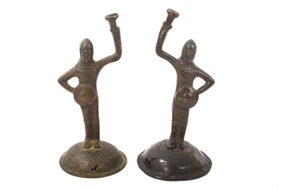 Lot 747 - Pair of bronze figure wick light holders, with supports in the form of Medieval knights