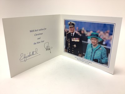 Lot 37 - H.M. Queen Elizabeth II and H.R.H. The Duke of Edinburgh, signed 2014 Christmas card with twin gilt Royal cyphers to the cover, colour photograph to the interior of the Royal couple at the naming...