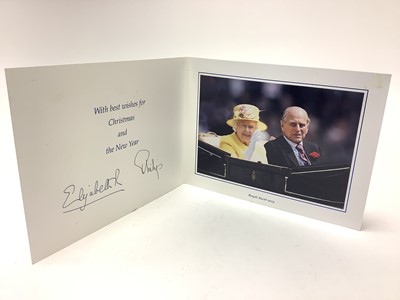 Lot 38 - H.M. Queen Elizabeth II and H.R.H. The Duke of Edinburgh, signed 2013 Christmas card with twin gilt Royal cyphers to the cover, colour photograph to the interior of the Royal couple riding i...