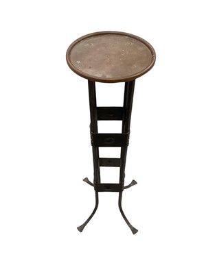 Lot 1528 - Arts and Crafts wrought iron stand with copper circular top