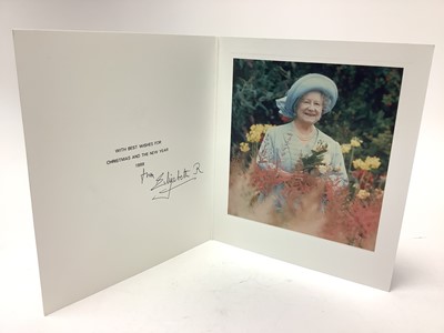 Lot 46 - H.M. Queen Elizabeth The Queen Mother, signed 1988 Christmas card with gilt embossed crown to cover, colour photograph of Her Majesty in a field of wild flowers, signed in ink ' from Elizabeth R'...