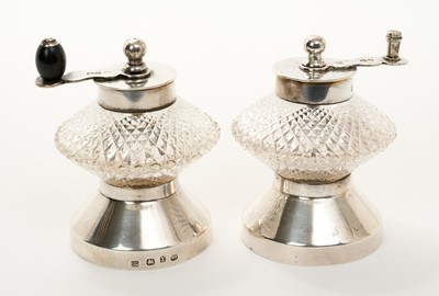 Lot 253 - Pair of silver mounted cut glass pepper grinders in the style of Dr. Christopher Dresser