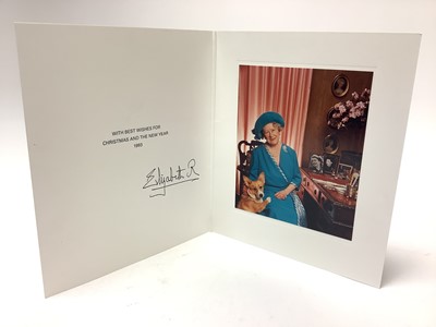 Lot 51 - H.M. Queen Elizabeth The Queen Mother, signed 1993 Christmas card with gilt embossed crown to cover, colour photograph of Her Majesty wearing a blue dress with an attentive Corgi, signed in ink '...