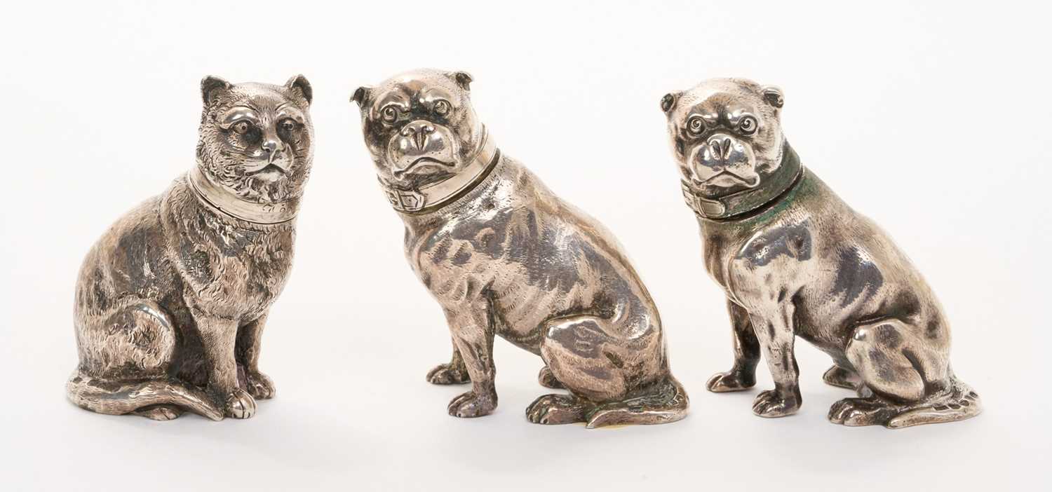 Lot 200 - Pair of Victorian cast silver pepperettes, in the form of a cat and pug dog and one other pug dog