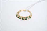 Lot 737 - Gold (18ct) emerald and diamond ring, the band...