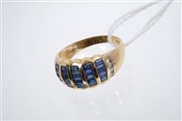 Lot 738 - Gold (18ct) sapphire and diamond ring, the...