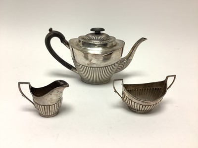 Lot 216 - Victorian silver three piece teaset with half reeded body