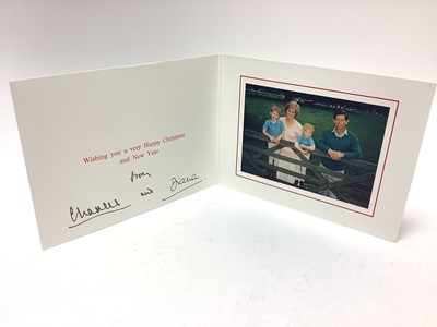 Lot 65 - T.R.H. The Prince and Princess of Wales, signed 1989 Christmas card with twin gilt Royal cyphers to cover, colour photograph of the smiling couple with their two young sons resting on a gate, sig...