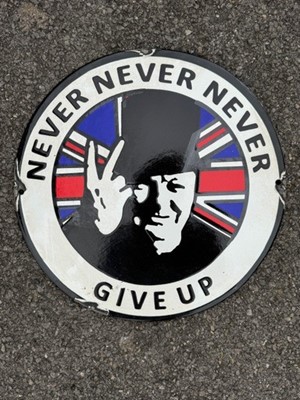 Lot 56 - Reproduction circular enamel sign depicting Sir Winston Churchill in his iconic 'V for Victory' pose, captioned "Never Never Never Give Up", 30.5cm in diameter.