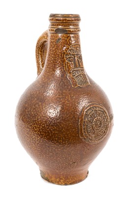 Lot 21 - 17th century Rhenish stoneware Bellarmine bottle with tiger glaze