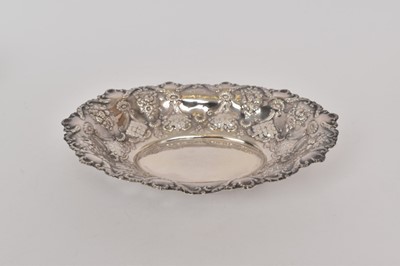 Lot 434 - Late Victorian silver oval dish with pierced and embossed scroll and floral decoration