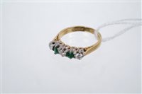 Lot 749 - Emerald and diamond five stone ring with two...