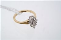 Lot 753 - Diamond cluster ring with a marquise-shape...