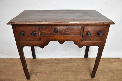 Lot 1162 - 18th century fruitwood three drawer lowboy