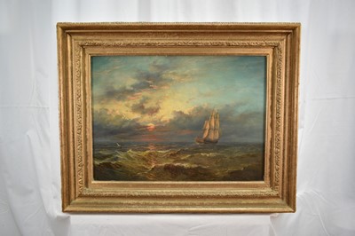 Lot 1129 - John Moore of Ipswich (1831-1895) oil on panel - Ship under Sail at Dusk, signed and dated 1880, 33cm x 45cm, in gilt frame .