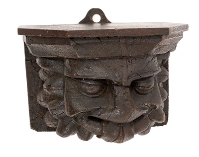 Lot 814 - Early carved oak 'Green Man' shelf bracket